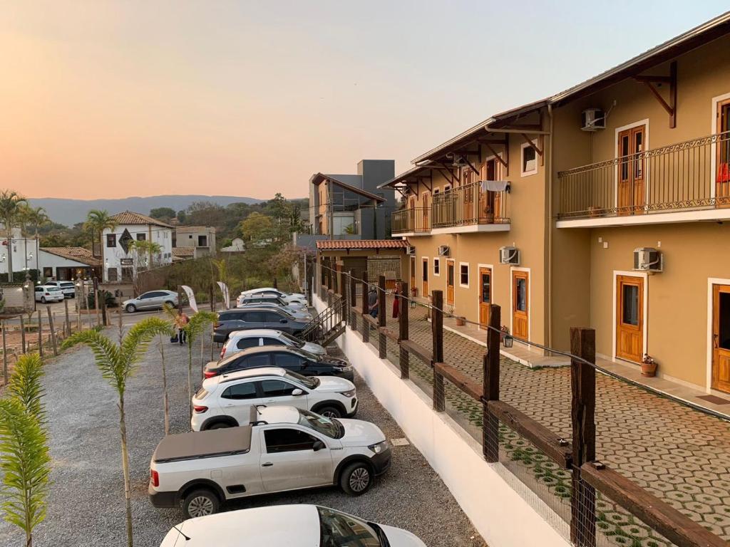 a row of cars parked in a parking lot at Flat dos Bandeirantes in Tiradentes