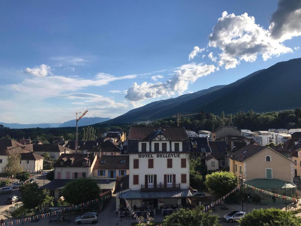 a view of a town with mountains in the background at HeberGeneve : Balcon sur le Jura in Gex