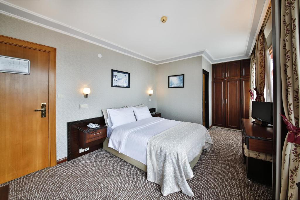 Postel nebo postele na pokoji v ubytování Sidonya Hotel