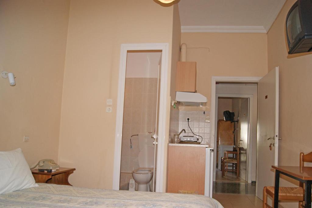 Postel nebo postele na pokoji v ubytování Foivos