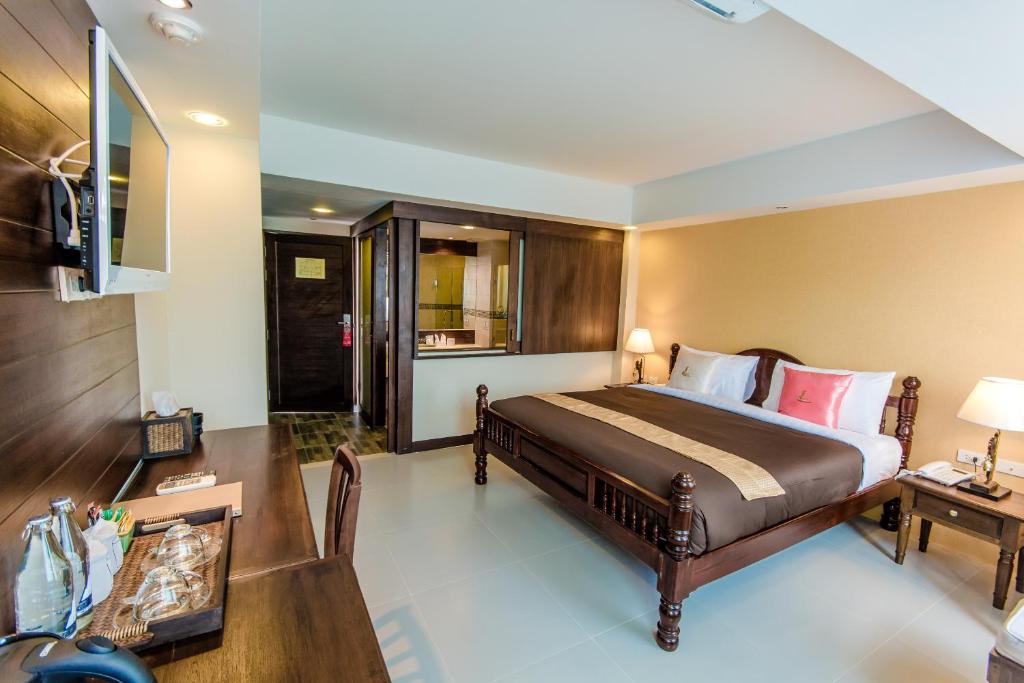 TV a/nebo společenská místnost v ubytování Goldenbell Hotel Chiangmai
