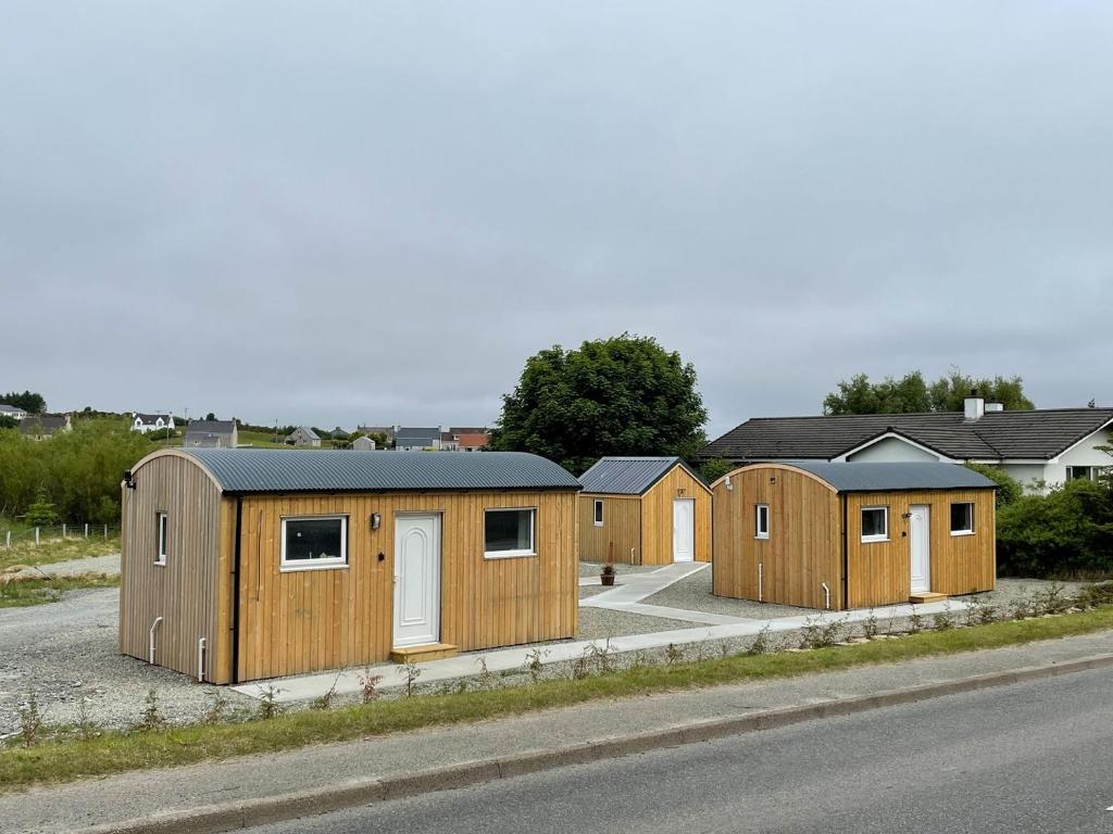 a row of tiny homes on the side of a road at Lewis - Uk34047 in Stornoway