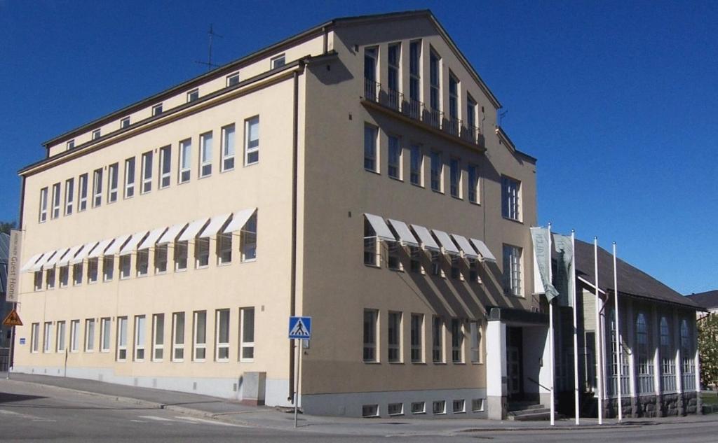 a large white building with a lot of windows at Jugend Boutique Hotel in Pietarsaari