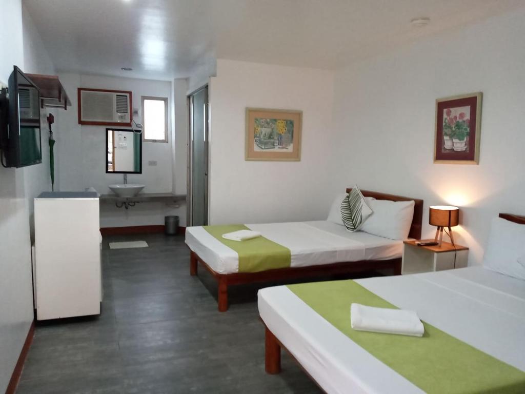 Postel nebo postele na pokoji v ubytování MR Holidays Hotel