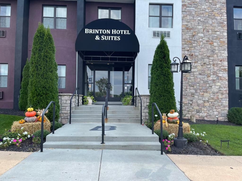 a building with a sign that reads benjamin hotel and suites at Brinton Suites in West Chester