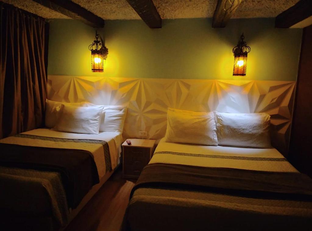 Postel nebo postele na pokoji v ubytování Villa Suite Emanuel