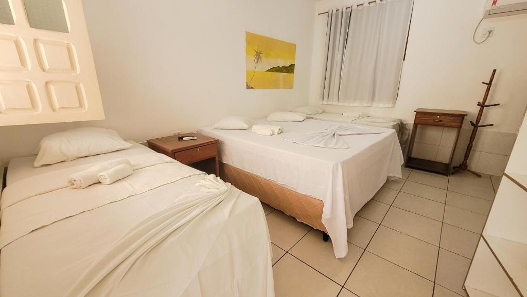 Cama ou camas em um quarto em Brisa do Caitá Praia Hotel