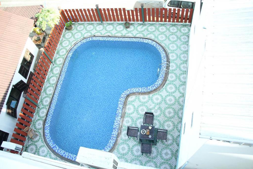 an overhead view of a swimming pool on a building at Vang Vieng Freedom Star's Hotel in Vang Vieng