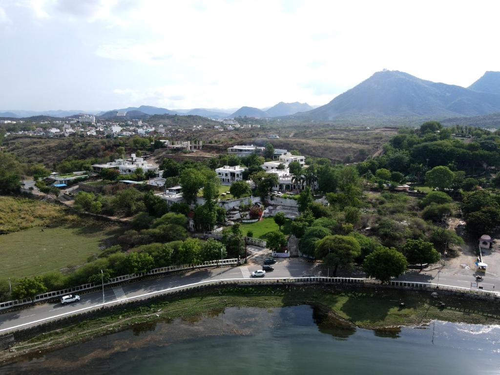 an aerial view of a city with a bridge over a river at Devendragarh Palace - Luxury Paying Guest House in Udaipur