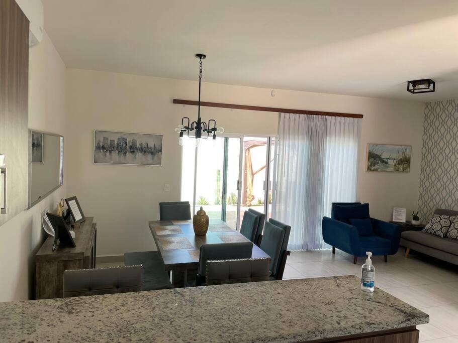 a kitchen and living room with a table and chairs at CASA YEYI in La Paz