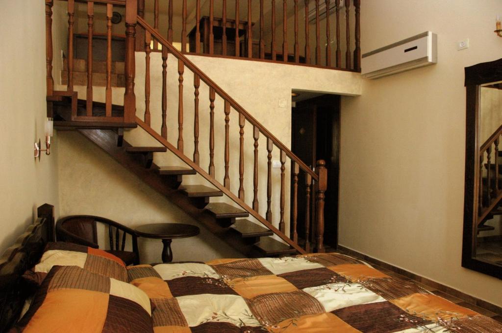 Postel nebo postele na pokoji v ubytování Akkotel-Boutique hotel
