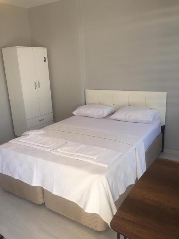 Postel nebo postele na pokoji v ubytování Zelya İstanbul flats