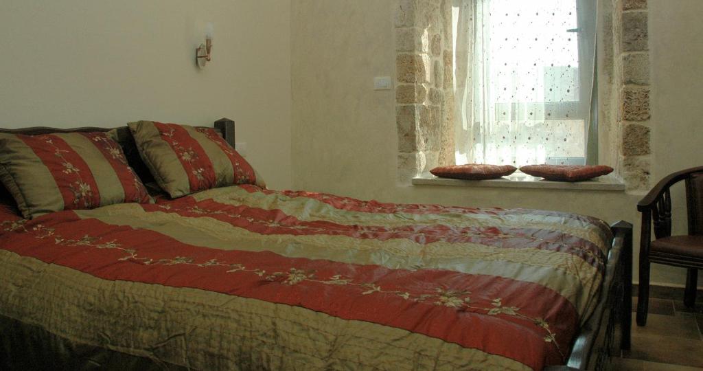 Postel nebo postele na pokoji v ubytování Akkotel-Boutique hotel