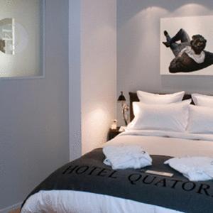 Postel nebo postele na pokoji v ubytování Hôtel Quatorze