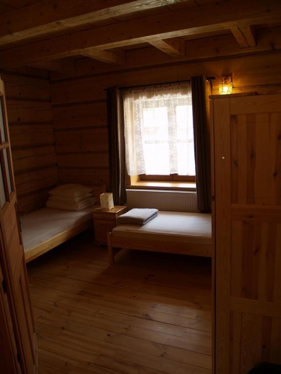 Postel nebo postele na pokoji v ubytování Biesówka