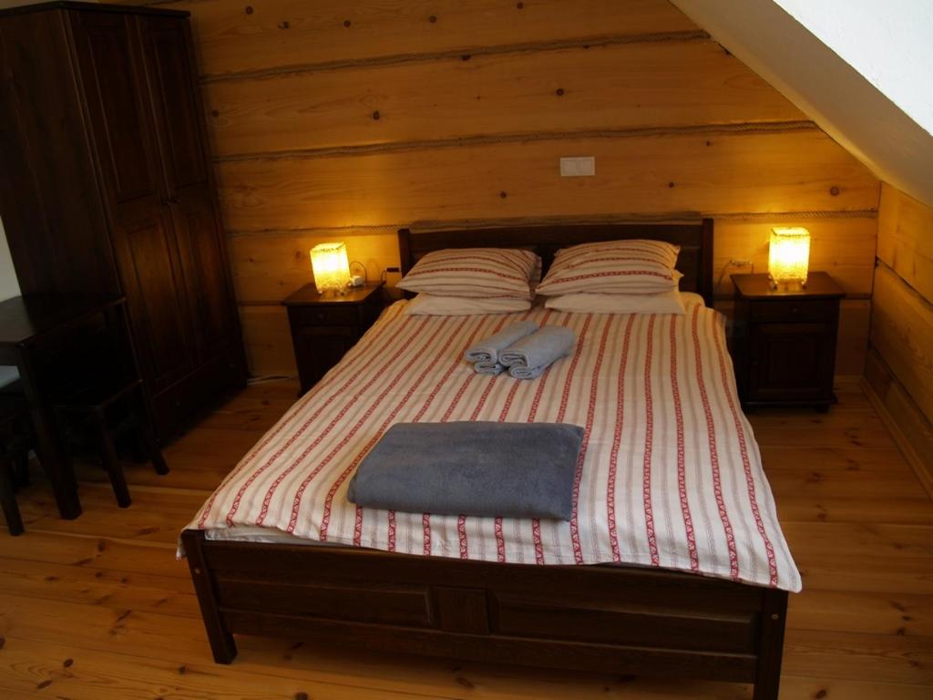 Postel nebo postele na pokoji v ubytování Biesówka