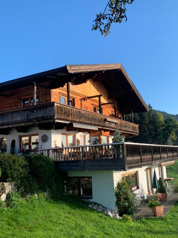 a large building with balconies on the side of it at Altenhauser Hof in Kössen