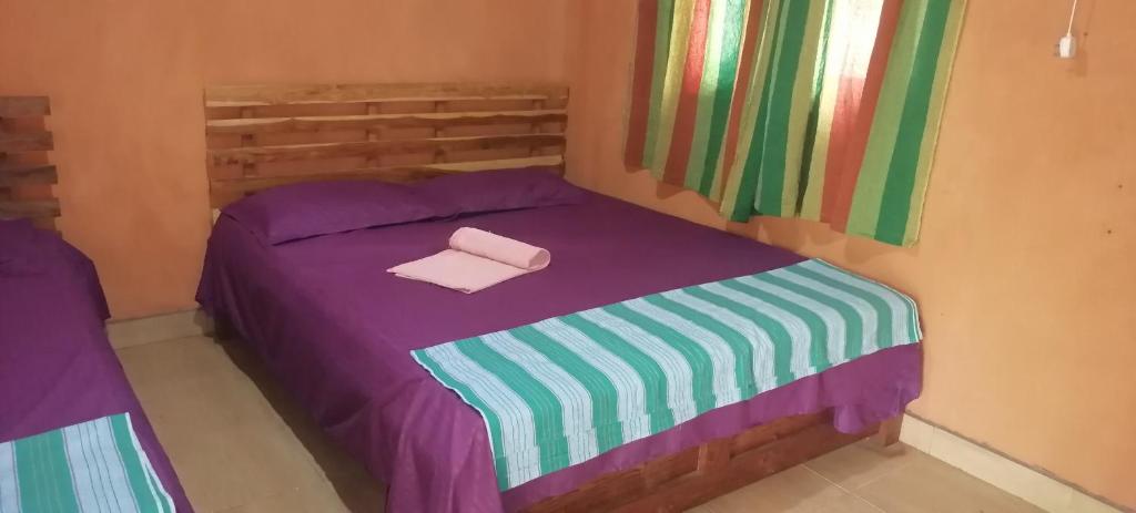 Postel nebo postele na pokoji v ubytování කැලෑව Jungle Eco Resort