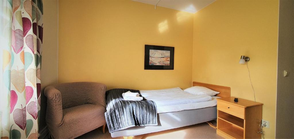Postel nebo postele na pokoji v ubytování Nipanhotellet