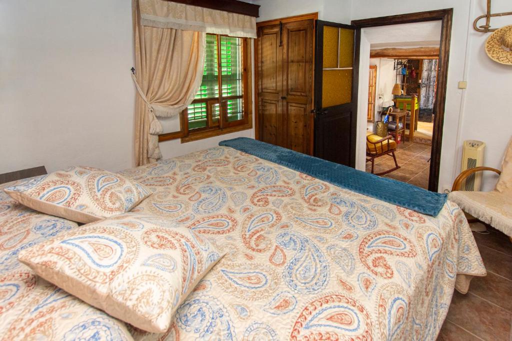 A bed or beds in a room at Sa Caseta de Santa Maria