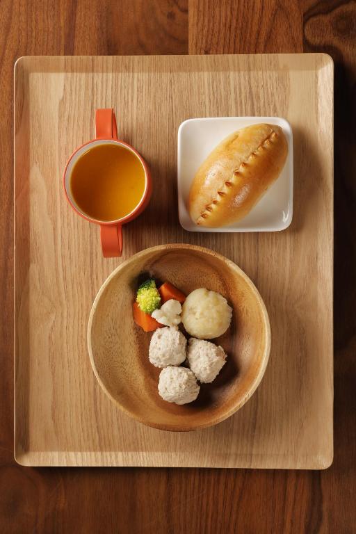 a wooden tray with a plate of food and a bowl of soup at Matsumoto Jujo in Matsumoto