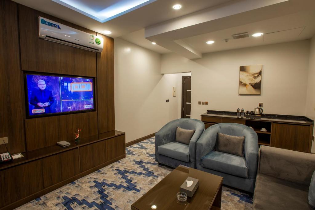 TV a/nebo společenská místnost v ubytování فندق امان أبها - المحالة