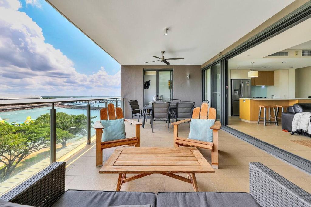 a living room with a view of the ocean at Darwin's Dazzler - Your Ultimate Waterfront Escape in Darwin