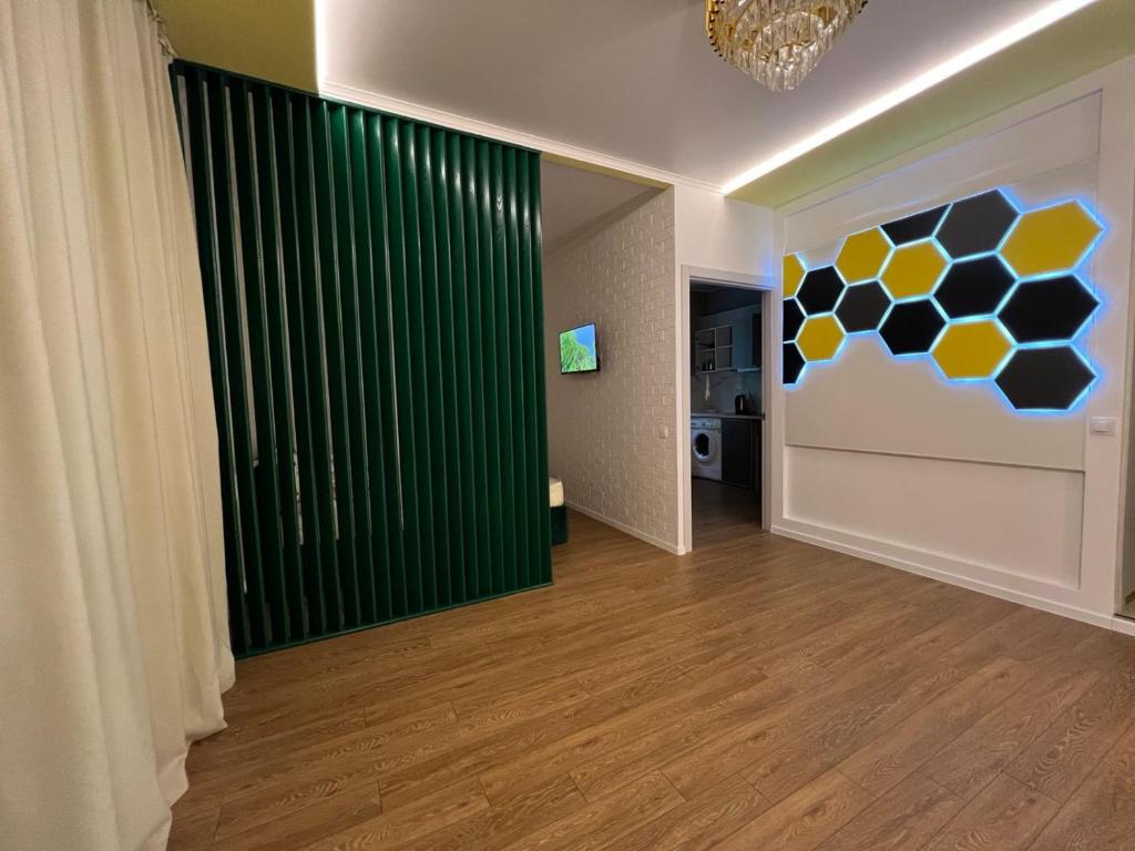 a room with a green wall with a soccer wall at NEW STAIL in Bălţi