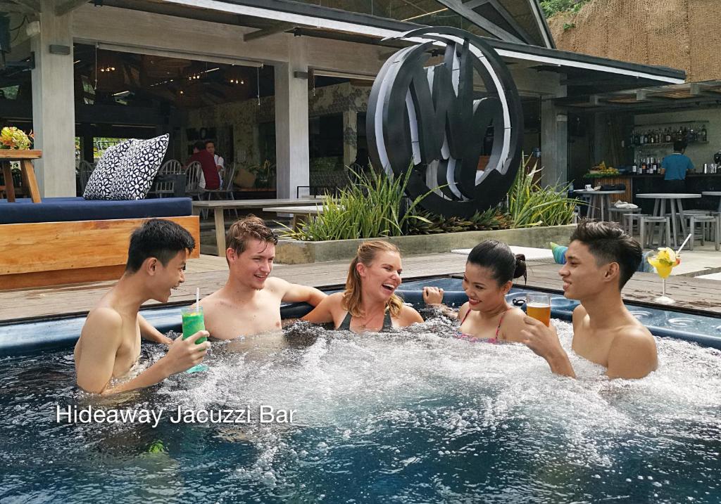 a group of people in a swimming pool at Fairways and Bluewater Boracay in Boracay