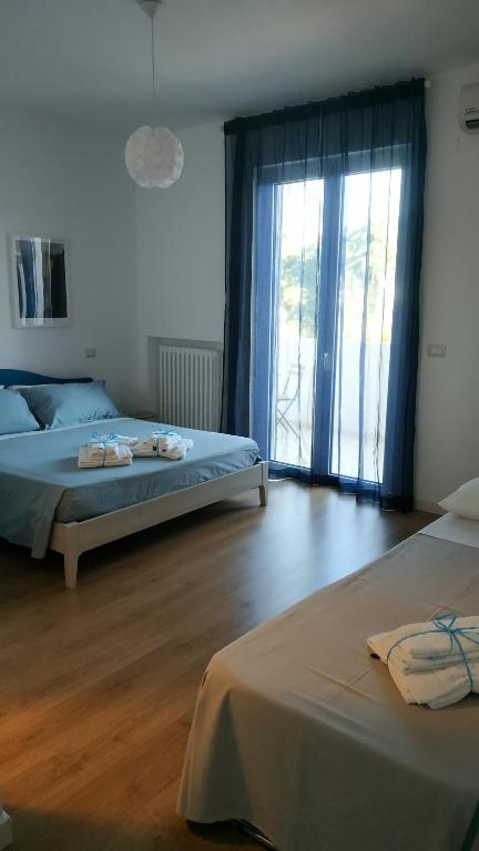 Posteľ alebo postele v izbe v ubytovaní Il Cantico B&B