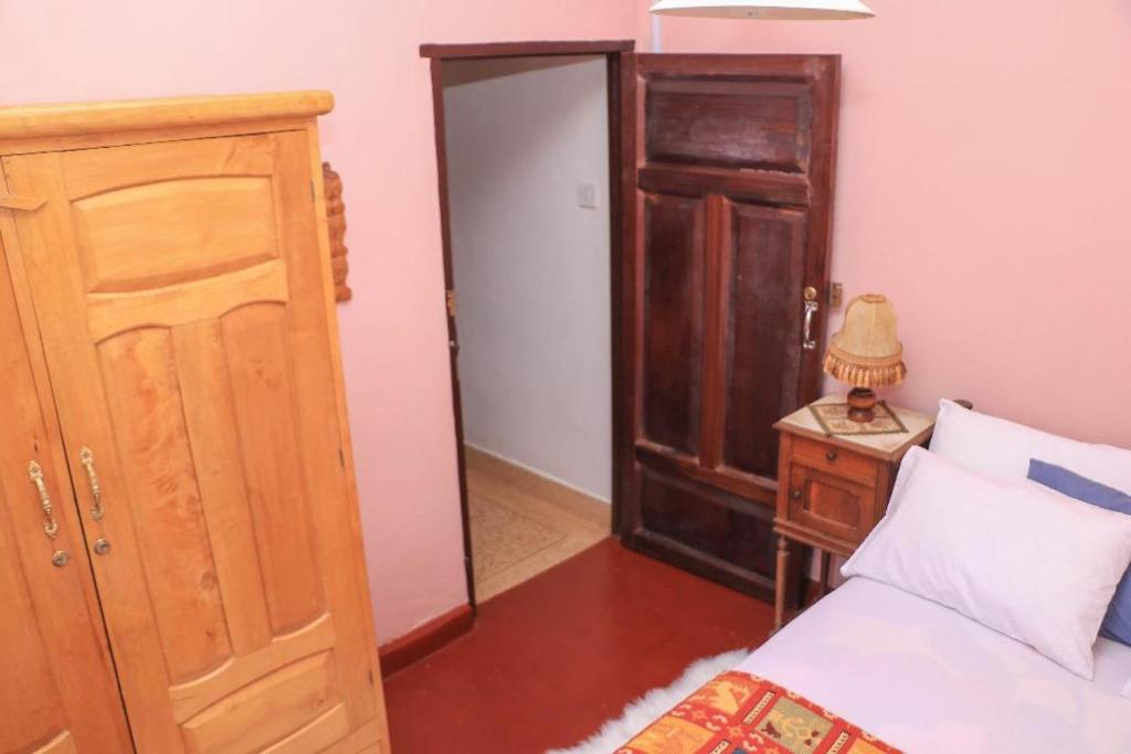 Postel nebo postele na pokoji v ubytování Nyahururu Highlands Heaven -BnB