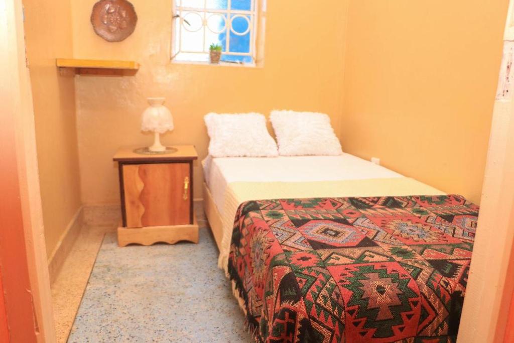 Postel nebo postele na pokoji v ubytování Nyahururu Highlands Heaven -BnB