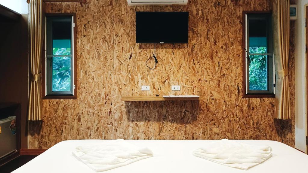 Postel nebo postele na pokoji v ubytování Nua Tone Resort Bang Tao & Cafe