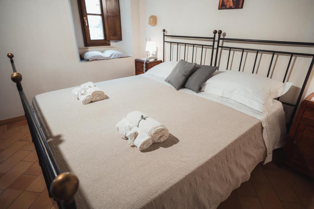 Posteľ alebo postele v izbe v ubytovaní Affittacamere L'Alunno