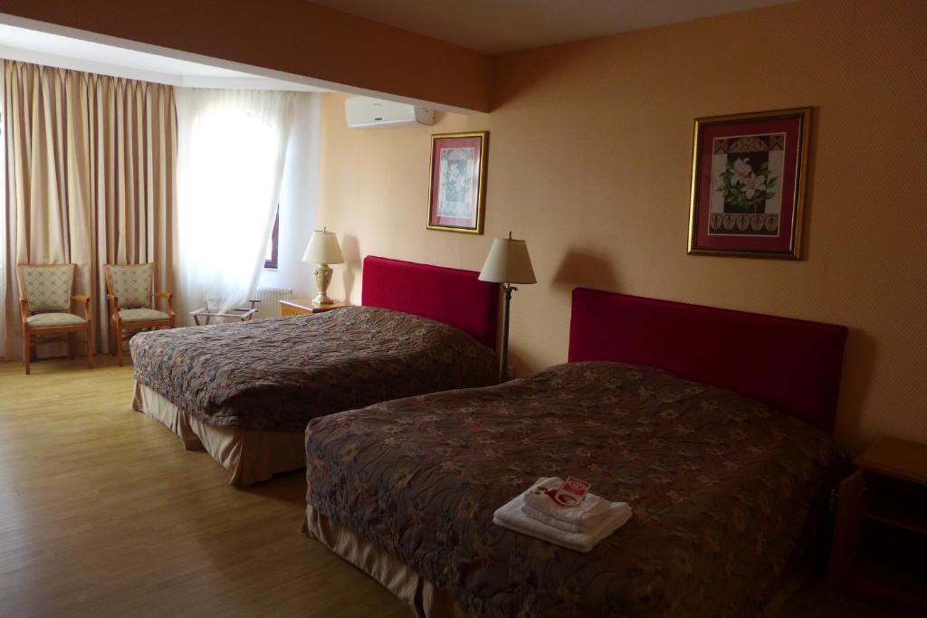 Postel nebo postele na pokoji v ubytování Guesthouse Belgrade