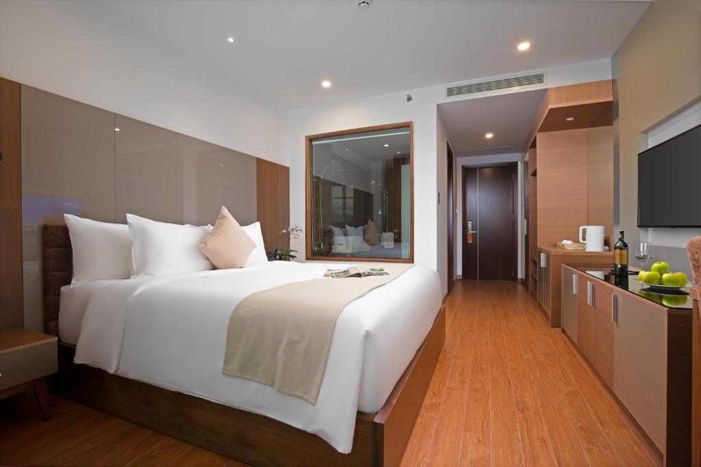 Postel nebo postele na pokoji v ubytování Alan Sea Hotel Danang