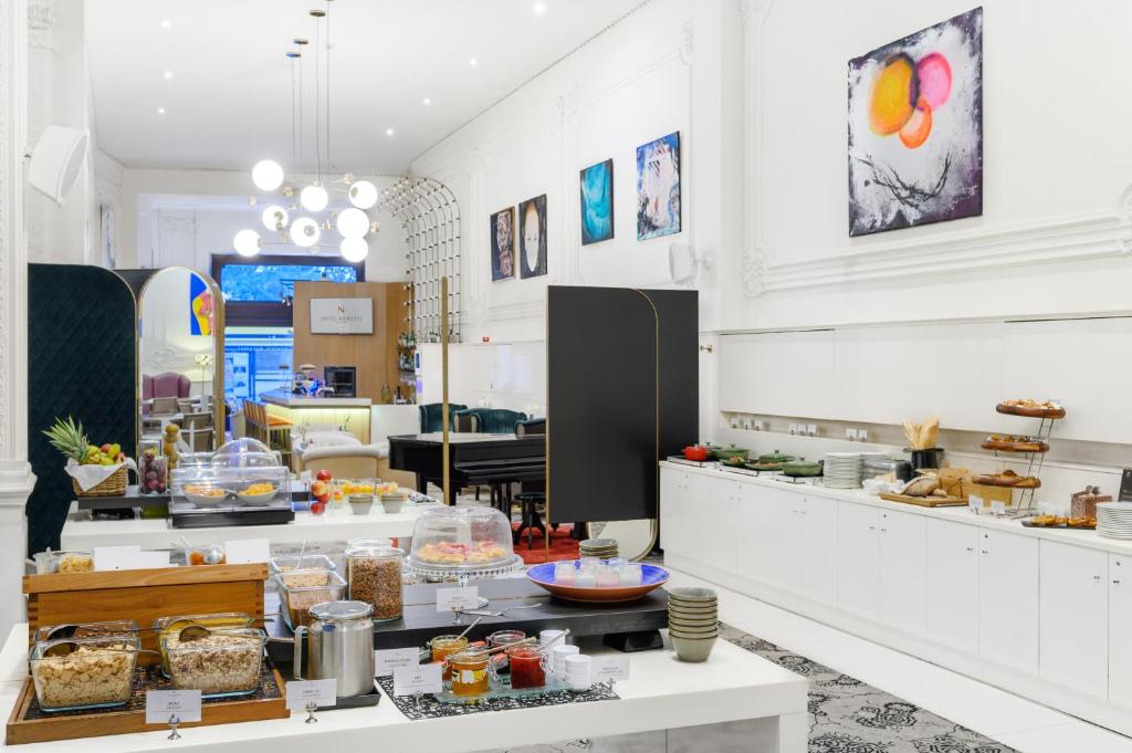 a kitchen with a counter with food on it at Nemzeti Hotel Budapest - MGallery Collection in Budapest