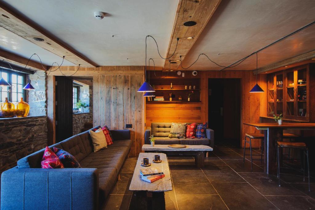 a living room with a couch and a table at Albion Aberteifi in Cardigan