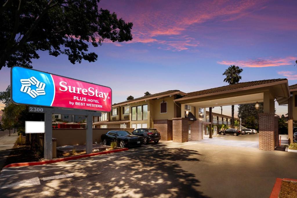 a sign in front of a hotel parking lot at SureStay Plus Hotel by Best Western Mountain View in Mountain View