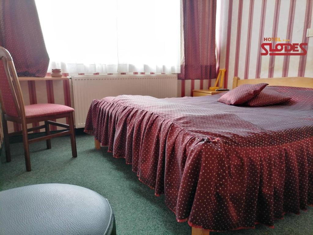 Postel nebo postele na pokoji v ubytování Hotel Slodes