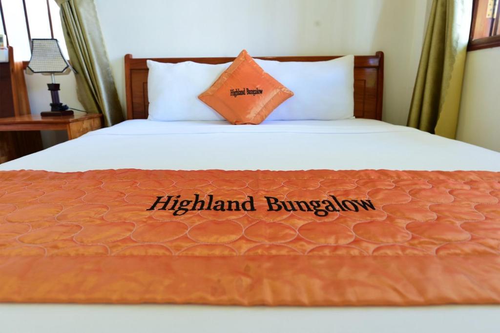 Tempat tidur dalam kamar di Highland Bungalow