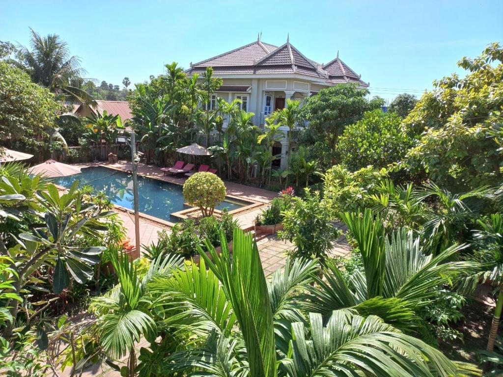 an aerial view of a house with a swimming pool and trees at SANNA VILLA Residence in Siem Reap