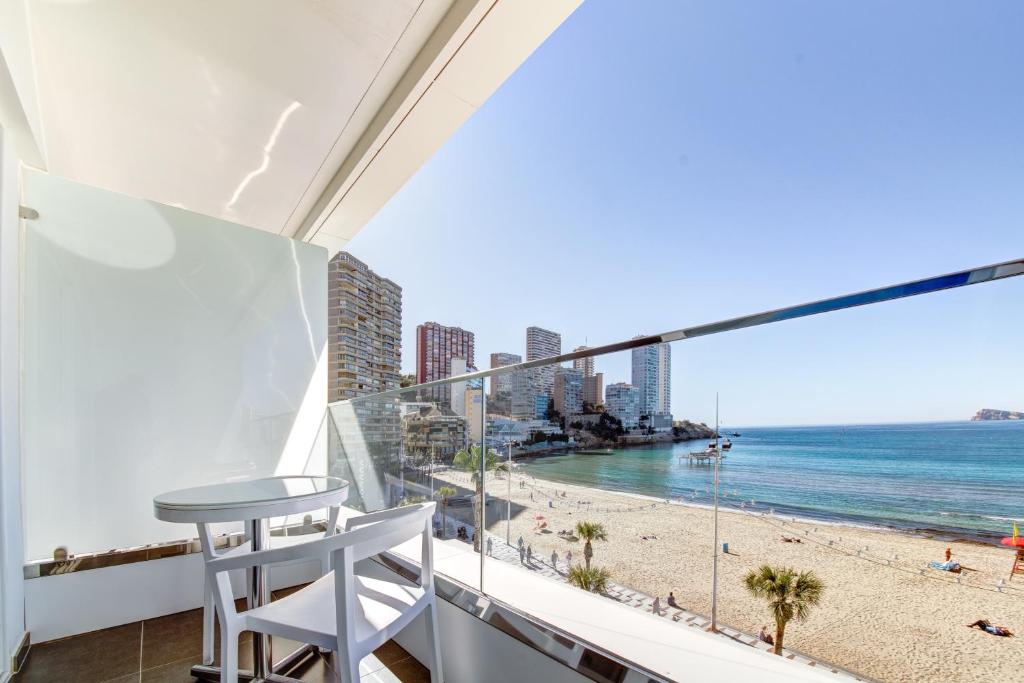 a balcony with a view of the beach at Hotel Brisa in Benidorm