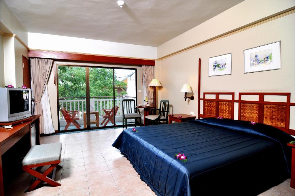 Postel nebo postele na pokoji v ubytování Karon Princess Hotel SHA EXTRA Plus