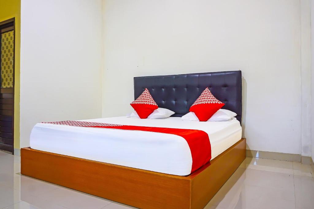 Säng eller sängar i ett rum på OYO 91668 Homestay Anitha Syariah Makassar