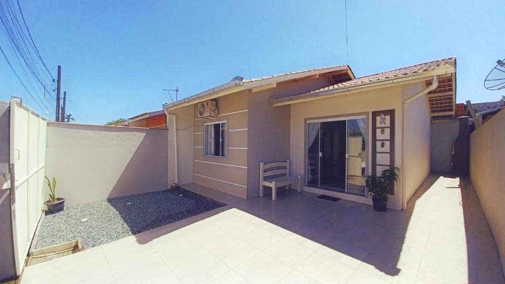 a small house with a patio in front of it at Casa_Margarida in Penha