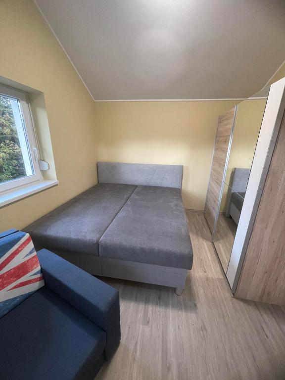 Łóżko lub łóżka w pokoju w obiekcie Moonlight Apartment