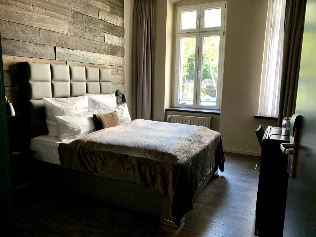מיטה או מיטות בחדר ב-Arbio I Apartmently Studios & Apartments