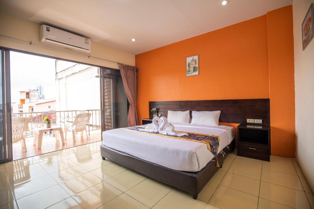 Postel nebo postele na pokoji v ubytování Lily Holiday hotel 百合假日酒店
