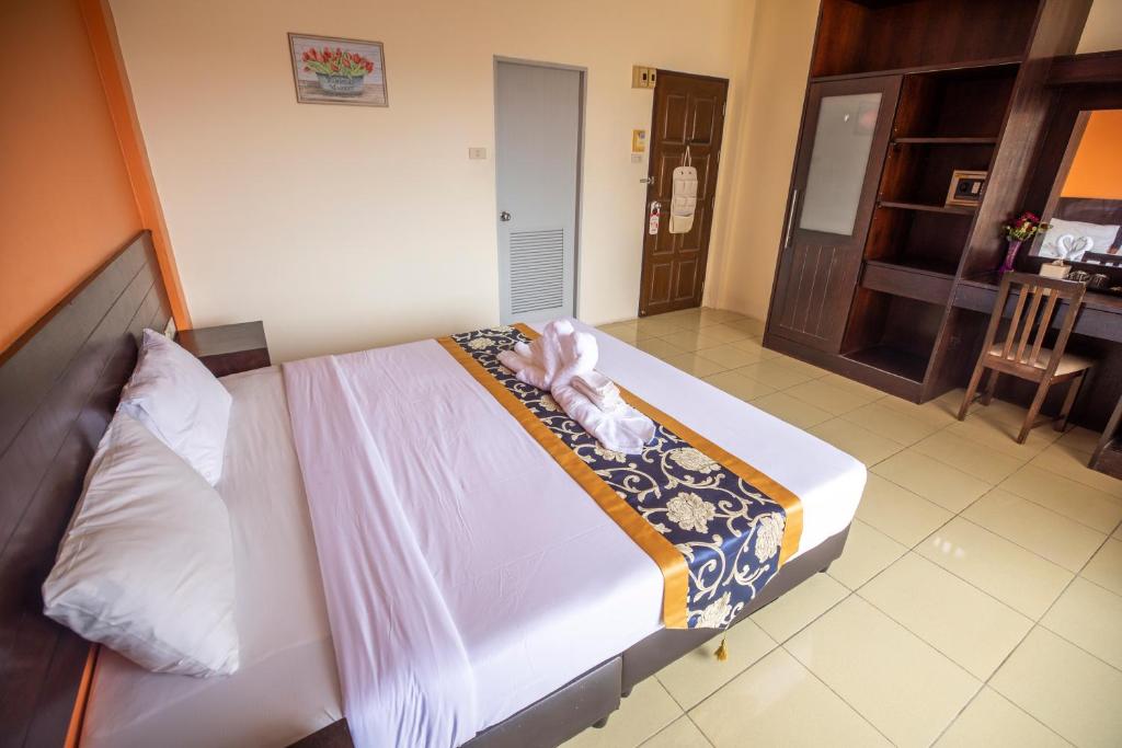 Postel nebo postele na pokoji v ubytování Lily Holiday hotel 百合假日酒店
